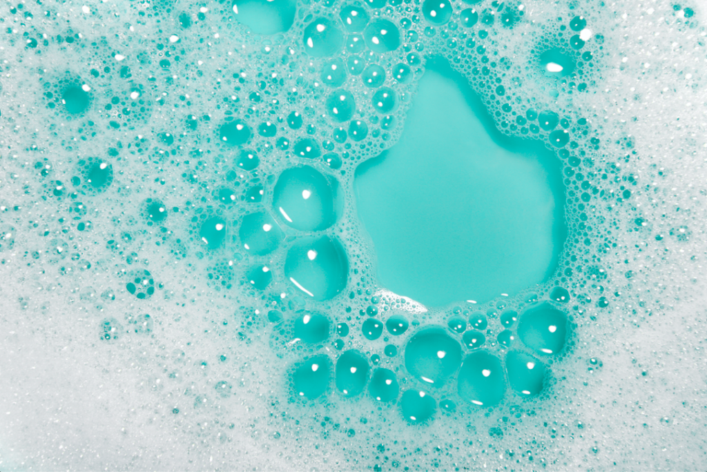 Soapy bubbles in a blue dish