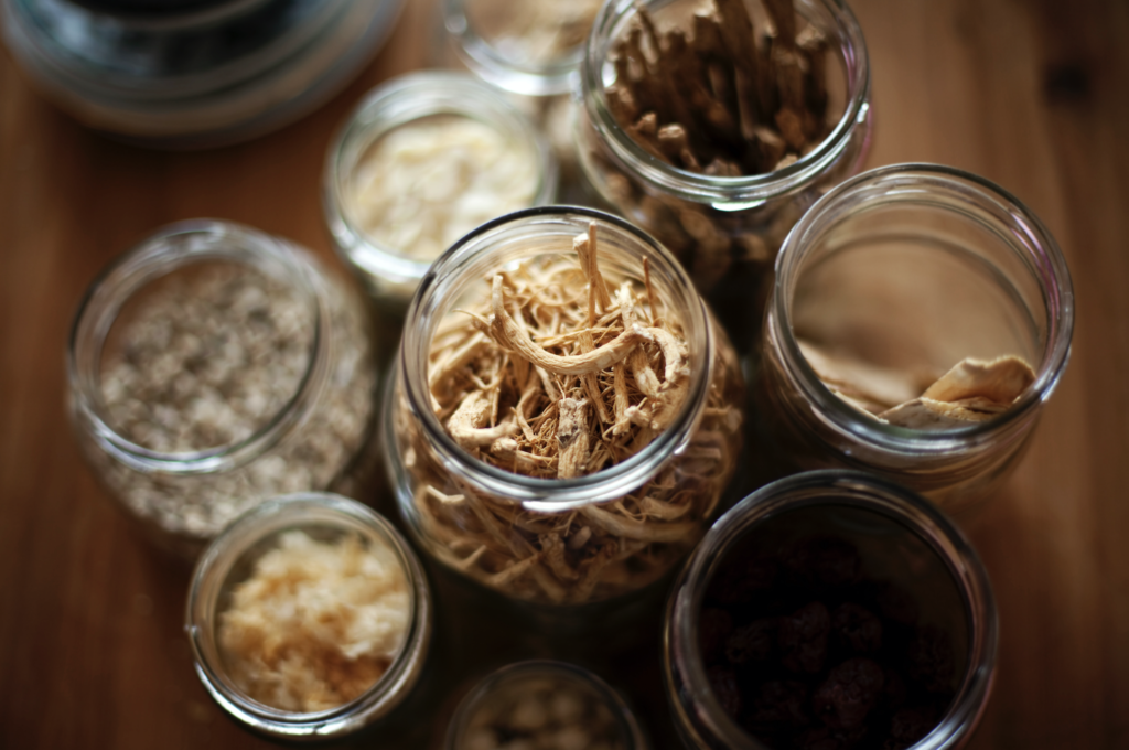 Traditional Chinese medicine herbs in glass jars
