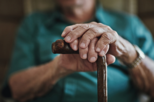 Elderly woman holding her cane